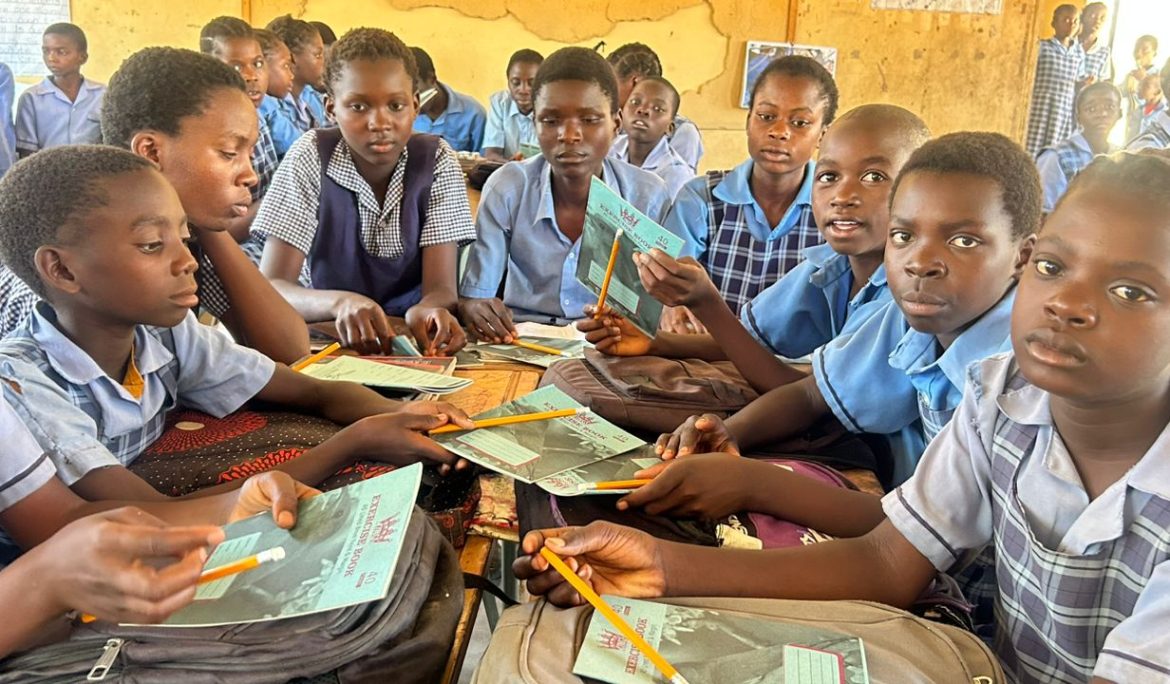 Group of school children holding books